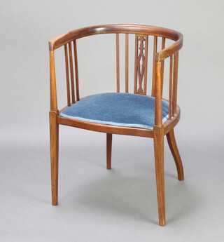 An Edwardian inlaid mahogany stick and rail back tub back chair, seat upholstered in blue material 