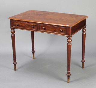 A Victorian rectangular mahogany library table fitted 2 frieze drawers, raised on turned supports 74cm h x 90cm w x 55cm d 