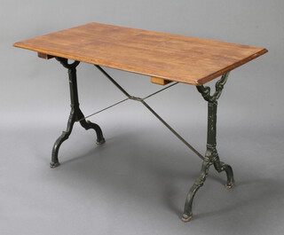 A Victorian style garden table with rectangular oak top raised on wrought iron supports 69cm h x 109cm l x 59cm w 