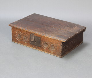 A 17th/18th Century carved oak bible box with chip carving to the edge, the apron carved roundels and marked MB 17cm h x 62cm w x 41cm d 