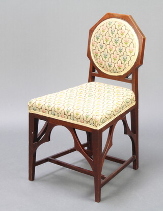 An Edwardian Chippendale style mahogany bedroom chair with shaped back and wedge shaped seat upholstered in Berlin woolwork, raised on square tapered supports