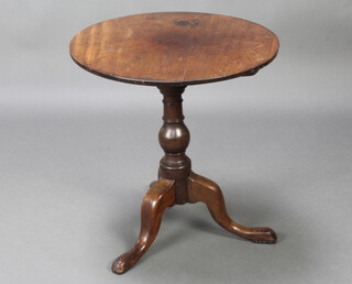 A 19th Century circular mahogany tea table, raised on a turned column and tripod base 66cm h x 62cm diam. 