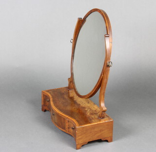 A Sheraton style oval plate dressing table mirror contained in a mahogany frame and raised on serpentine fronted base fitted 1 long and 2 short drawers, raised on bracket feet 60cm h x 45cm w x 21cm d 
