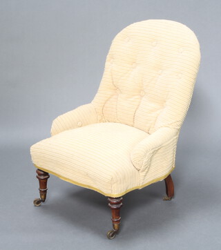 A Victorian metal framed nursing chair upholstered in yellow corduroy material 