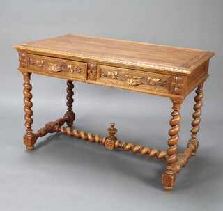 A Victorian carved oak library table fitted 2 frieze drawers with lion mask handles, raised on spiral turned supports with H framed stretcher 74cm h x 115cm w x 64cm d 