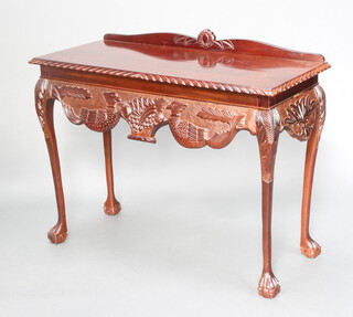 Higginbottom of Dublin, a Georgian style carved mahogany serving table with raised back, raised on cabriole ball and claw supports 85cm h x 106cm w x 46cm d 