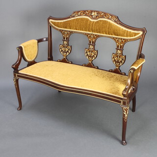 An Edwardian inlaid mahogany two seat sofa with inlaid shaped slat back, upholstered in brown material, raised on club supports 92cm h x 115cm w x 51cm d 