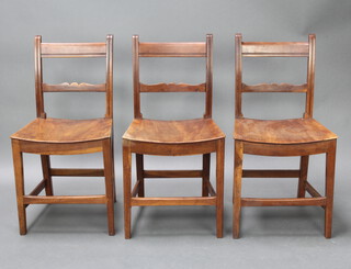 A set of 3 18th Century elm and fruitwood country ladderback dining chairs with solid seats 