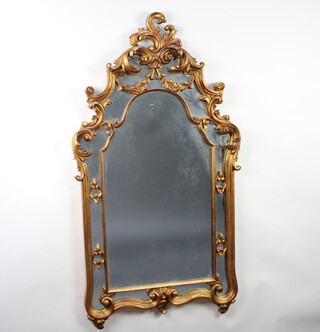 An Italian style arched plate mirror contained in a decorative carved hardwood gilt frame 132cm h x 71cm w 