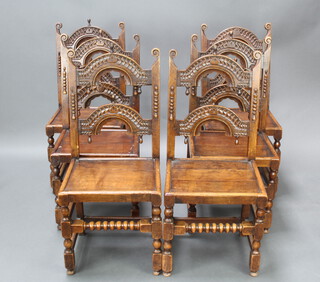 A set of 6 17th/18th Century style arched and carved ladder back dining chairs with solid seats raised on turned and block supports 