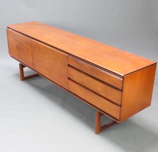 White & Newton Ltd of Portsmouth, a stylish 1960's teak sideboard, fitted a cupboard and cocktail unit flanked by 3 drawers, raised on angled supports 69cm h x 198cm w x 43cm d  