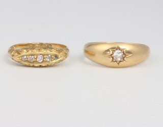 An 18ct yellow gold single stone diamond ring, a 5 stone ditto, 7.5 grams, sizes M and O 