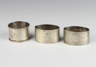 A pair of silver napkin rings Birmingham 1933 and 1 other, 92 grams