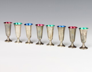 A set of 8 Gorham Sterling silver tapered tots with coloured interiors, 160 grams, 7cm 