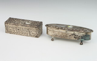An Edwardian oval silver trinket box on claw and ball feet, Birmingham 1905 together with a rectangular repousse silver box (holed) 156 grams 