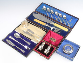 A set of 6 Edwardian silver coffee spoons, Sheffield 1901, a pair of cased silver condiments, 2 cased sets and a photograph frame 134 grams 