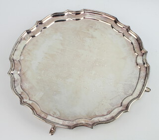 A silver salver with Chippendale rim and presentation inscription, on hoof feet, Sheffield 1995, 25cm, 470 grams