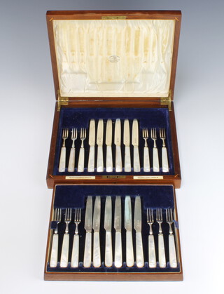 A walnut canteen containing a set of 12 mother of pearl and silver dessert eaters, Sheffield 1931 Goldsmith & Silversmiths Co Ltd