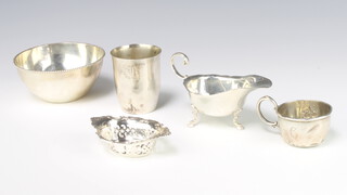 A Sterling silver sauce boat on scroll feet, a mug, beaker, bowl and dish, 280 grams 