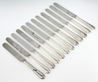 A set of 12 silver handled dinner knives with beaded decoration 
