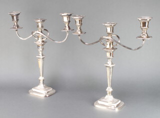 A pair of silver plated 3 light candelabra on tapered stems 48cm 