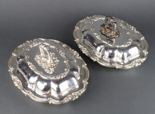 A pair of silver plated entree sets 