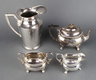 A silver plated 3 piece tea set with beaded rim and a plated lemonade jug 