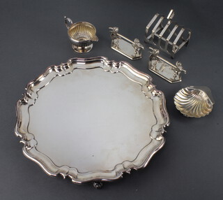 A silver plated salver with Chippendale rim 31cm, a pair of knife rests and 3 others items