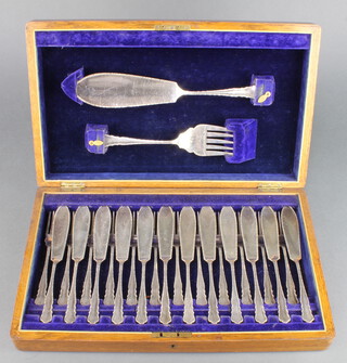 A set of silver plated fish eaters for 12 with servers contained in an oak canteen 