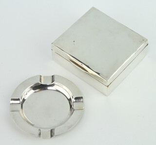 A circular silver ashtray Birmingham 1935 and a square silver cigarette box 8cm (marks rubbed) 