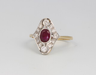 An 18ct yellow gold Edwardian style ruby and diamond cluster ring, the centre oval cut stone approx. 0.85ct surrounded by brilliant cut diamonds approx 0.3ct, size L 
