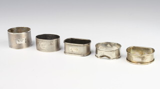 A silver engine turned napkin ring Sheffield 1931, 4 others, 92 grams