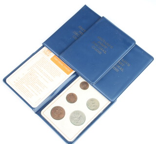 Four Britains first decimal coin sets 