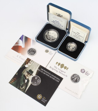 A 90th Birthday silver proof commemorative crown, a ditto 1989 silver proof one pound coin and 3 commemorative twenty pound coins 82.5 grams