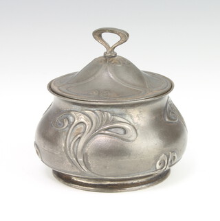 A WMF Art Nouveau circular repousse ex plated pot decorated with stylised flowers with glass liner no.109 7cm 