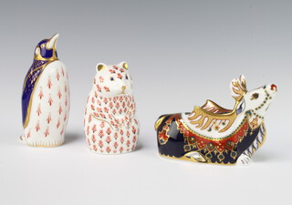 A Royal Crown Derby Imari pattern paperweight Reindeer with gold stopper, 10cm, ditto bear 10cm (no stopper) and a penguin 15cm with silver stopper  