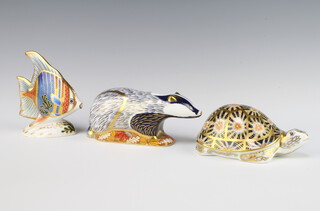A Royal Crown Derby Imari pattern paperweight Indian Star Tortoise with gold stopper 14cm, ditto Woodland Badger silver stopper 17cm and a Pacific Angel Fish silver stopper no.301/2500 12cm 