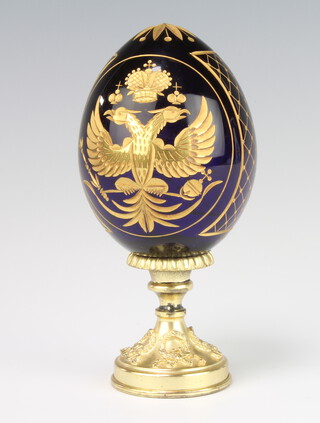 A Faberge Collection Romanov eagle egg on a gilt metal base 15cm, boxed 