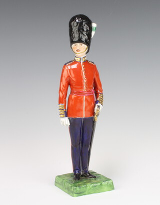A Dresden figure of a standing Welsh guardsman 27cm 
