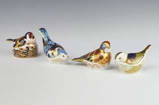 A Royal Crown Derby Imari pattern paperweight Fair Crest gold stopper 8cm, a Linnet gold stopper 9cm, Mountain Bluebird 14cm and a Goldfinch Nesting gold stopper 8cm 