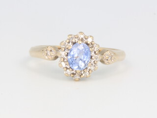 A 9ct yellow gold tanzanite and diamond cluster ring, size K, 1.8 grams