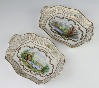 A pair of rounded rectangular Dresden baskets with pierced borders and riverscape panels 26cm 