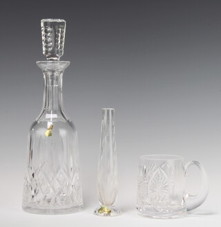 A Waterford Crystal decanter and stopper 32cm, ditto vase 18cm and a jug 10cm 