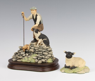 A Border Fine Arts figure of a shepherd and sheep dog 17cm on a wooden stand together with a ditto lamb 8cm 