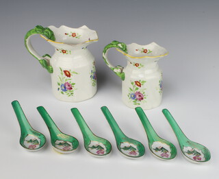 A 19th Century English jug decorated with flowers having a dragon handle 14cm, ditto 12cm (both cracked) and 6 Chinese soup spoons