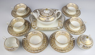 A Wedgwood Gold Florentine W4219 part tea set comprising tea pot, 6 tea cups, 6 saucers, 6 side plates, 1 sandwich plate, milk jug, sugar bowl 
