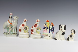 A Victorian Staffordshire figure of a giant sheep with Scotsman 20cm, a pair of ditto Spaniels before baskets of flowers, spill vase with a standing couple and 2 Spaniels