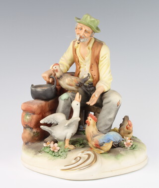 A Capodimonte figure of a farmer feeding chickens and geese 20cm 