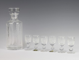 A circular Waterford Crystal decanter and stopper and six liqueur glasses 