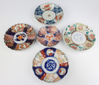 A Japanese Imari plate with lobed body and panel decoration 14cm together with 4 other Imari plates 19cm